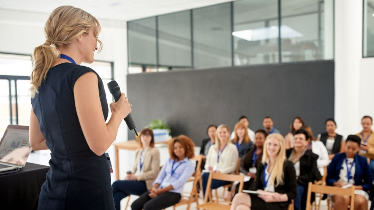 Shot of a young businesswoman delivering a presentation at a conference